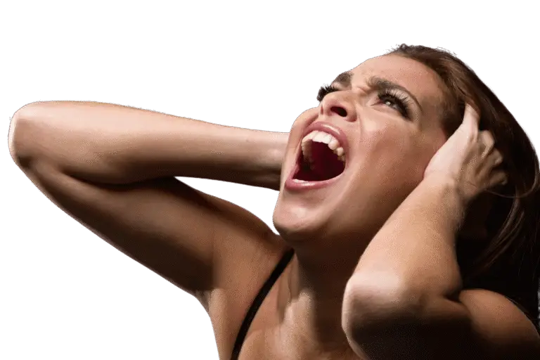 Person with long brown hair, hands on head, mouth open in a serene expression, looking upwards as if channeling healing energy against a plain background.