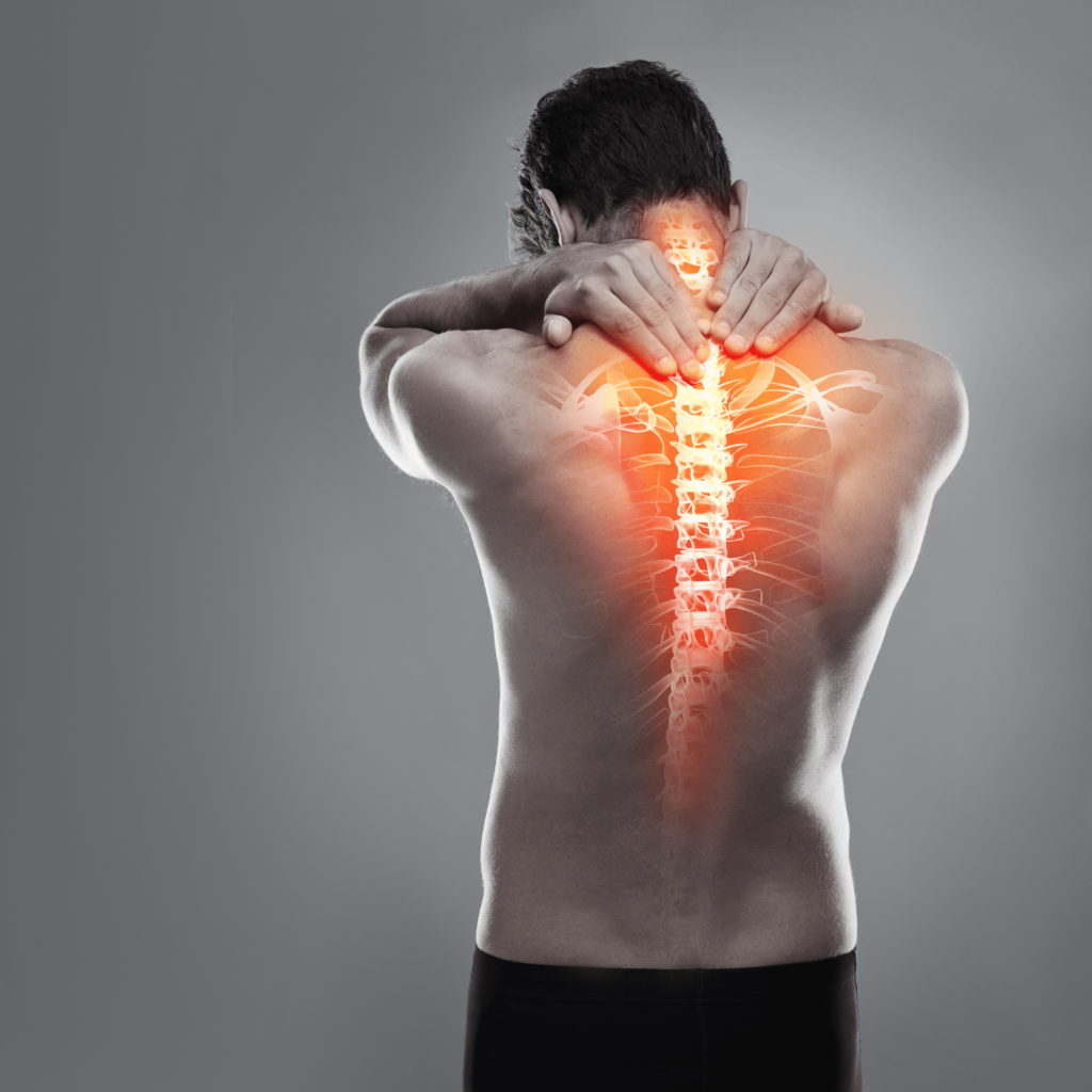 A man with back pain holds his neck, with an illustrated spine overlay highlighting the spinal column and joints in red, as if seeking reiki healing to alleviate his discomfort.